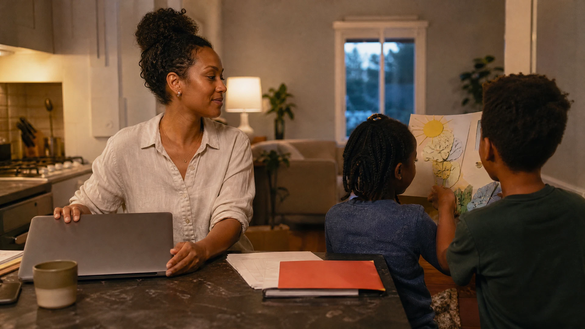 A mother closing her laptop and returning her attention to family time